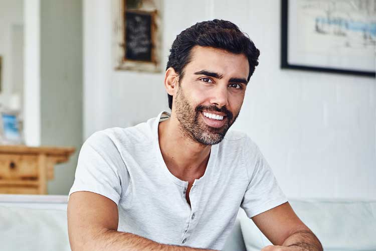 Man smiling on couch