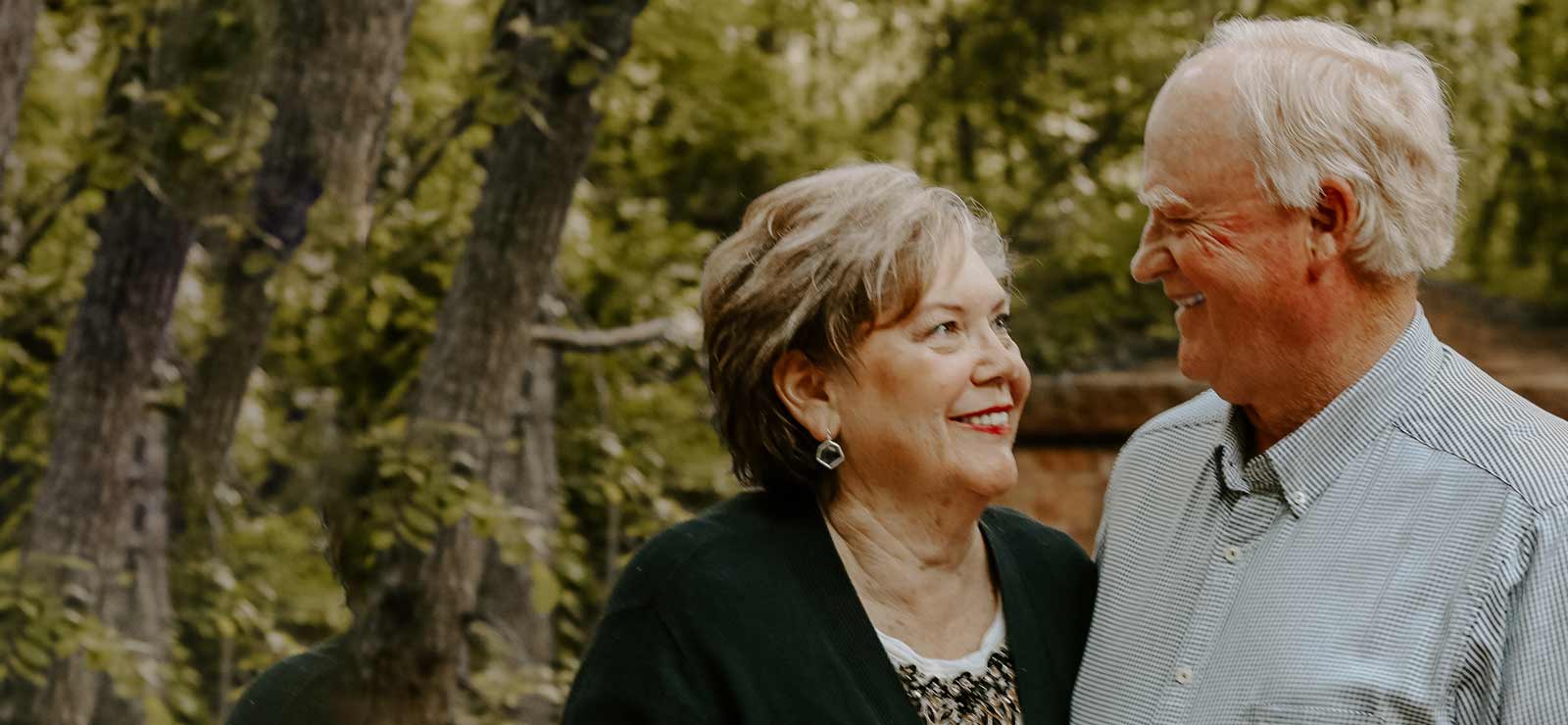 Older couple smiling at each other