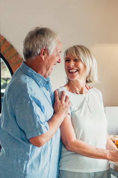 Older couple smiling at each other