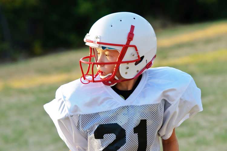 Young child playing football