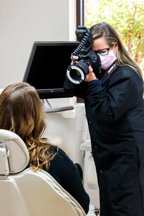 Dr. Tennille Cheek-Covey taking a photo of a patient
