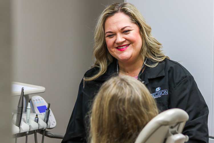 Dr. Tennille Cheek-Covey talking to a patient